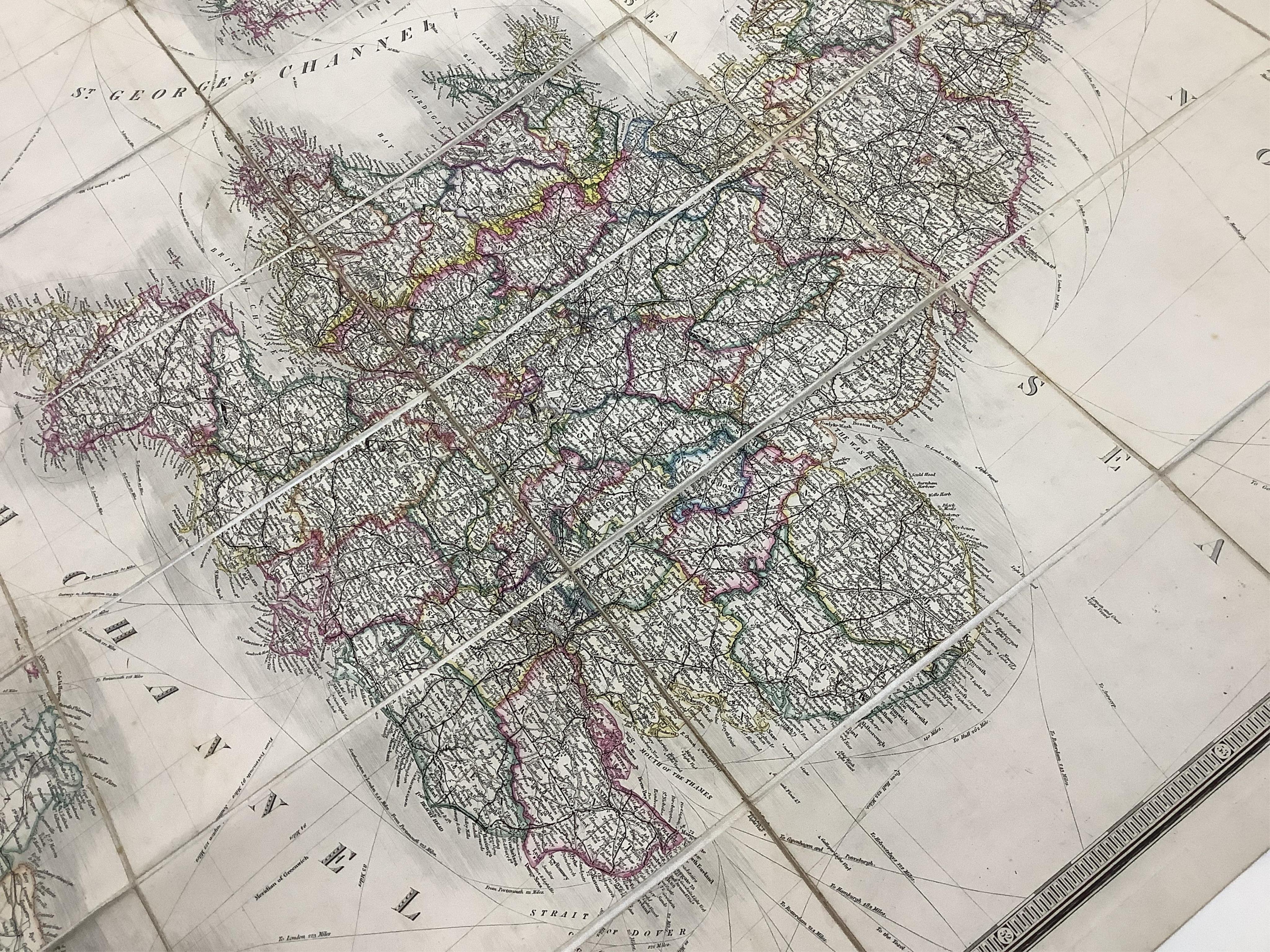 James Wyld, a mid-19th century cloth mounted map of the British Isles, including the line of railways, their primary and intermediate stations, etc. engraved by S. Stockley, in a slip case. Condition - poor to fair.